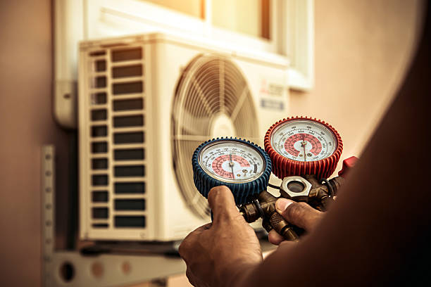 Professional Heat Pump Repair technician working in Elm Mott, TX